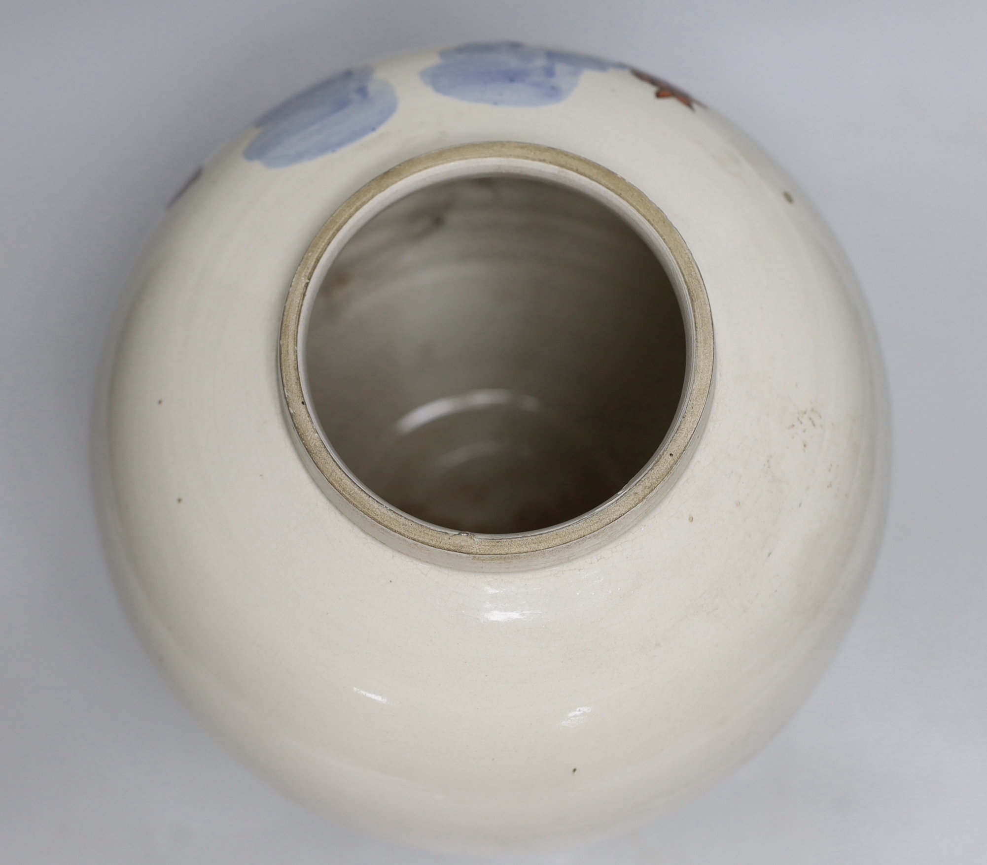 A Delft tobacco jar hand-painted with two figures, 28cm high